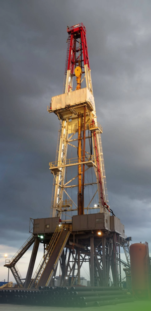 Directional drilling rig under a cloudy sky